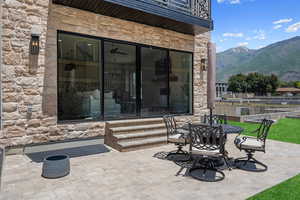 View of patio featuring a mountain views.  Evergreen tree line to be added spring 2025 to create your perfect oasis