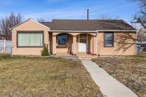 View of front of house featuring a front lawn