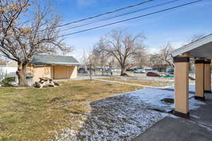 View of yard covered in snow