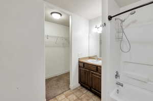 Bathroom with vanity and shower / bathtub combination