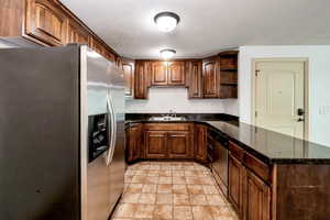 Kitchen featuring appliances with stainless steel finishes, sink