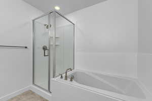 Bathroom with shower with separate bathtub