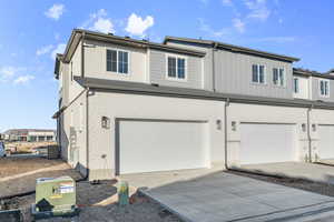 View of front of property featuring a garage