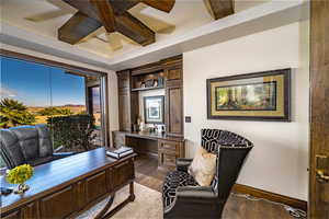 Office area featuring dark hardwood / wood-style flooring, beam ceiling, and coffered ceiling