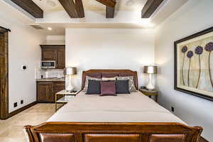 Bedroom featuring beam ceiling