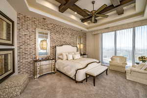 Carpeted bedroom with beam ceiling, brick wall, access to outside, and coffered ceiling