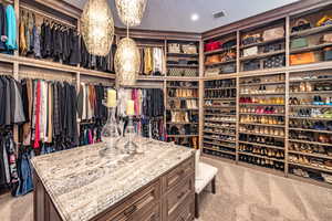 Spacious closet featuring carpet