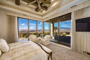 Bedroom with a mountain view, access to outside, and ceiling fan