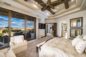 Bedroom featuring beam ceiling, carpet flooring, access to outside, connected bathroom, and coffered ceiling