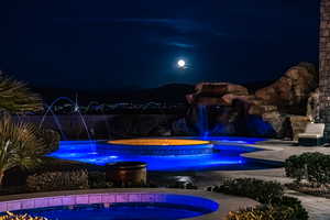 View of pool at twilight