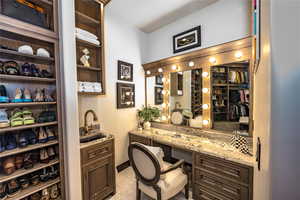 Interior space with indoor wet bar and light tile patterned floors