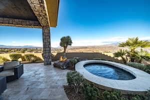 View of pool with a mountain view, an in ground hot tub, and a patio area