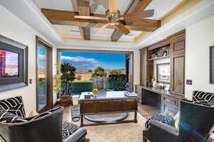 Office area with coffered ceiling, beamed ceiling, large picture windows allow for amazing views of the area.