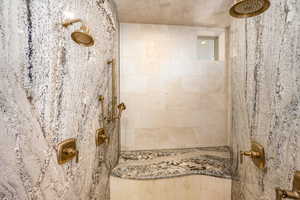 Bathroom featuring tiled shower