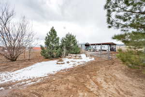 View of yard layered in snow