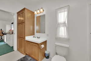 Bathroom with toilet and vanity