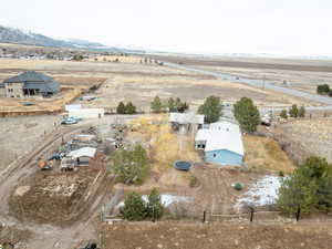 Birds eye view of property featuring a mountain view and a rural view