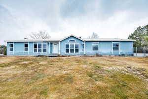 View of front of house with a front lawn