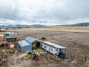 Drone / aerial view featuring a rural view and a mountain view