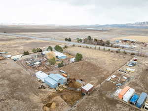 Birds eye view of property featuring a mountain view and a rural view