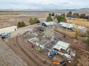 Birds eye view of property with a rural view and a mountain view