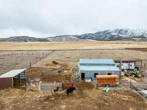 Property view of mountains with a rural view