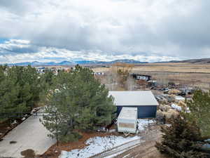 Snowy aerial view with a mountain view