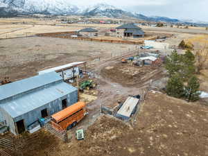 Birds eye view of property with a rural view and a mountain view