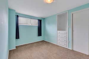 Unfurnished bedroom featuring carpet