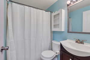 Bathroom with vanity and toilet