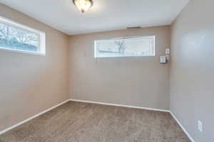 Empty room featuring carpet floors