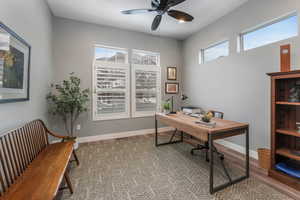 Home office with ceiling fan and Transom Windows