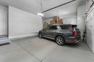 Oversized Garage featuring Epoxied Floors and Insulated Garage Door. Garage has an extra-pop-out for added garage width