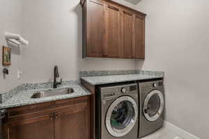 Laundry room with sink, Granite Countertops and  Cabinets