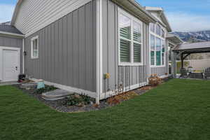 View of side of property with garage man door