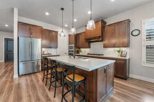 Quartz Countertops, Stain Grade Custom Cabinets, Large Island for additional Seating