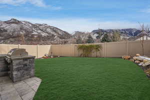 View of yard featuring a mountain view and area for grilling