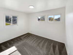 Empty room featuring carpet flooring