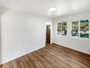 Unfurnished room with light hardwood / wood-style floors