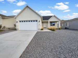 Ranch-style house featuring a garage