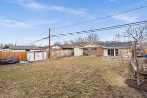 View of yard featuring a storage unit