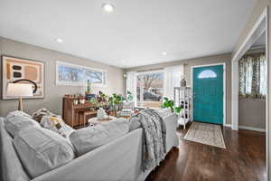 Living room featuring dark hardwood / wood-style flooring