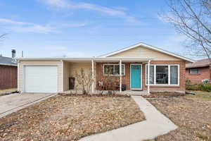 Single story home with a garage