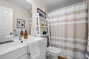 Bathroom with vanity and toilet