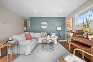 Living room with light hardwood / wood-style floors