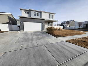 View of property with a garage