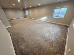 Empty room with carpet floors