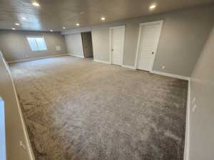 Basement featuring carpet flooring