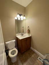 Bathroom featuring toilet and vanity