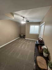 Interior space featuring ceiling fan and carpet